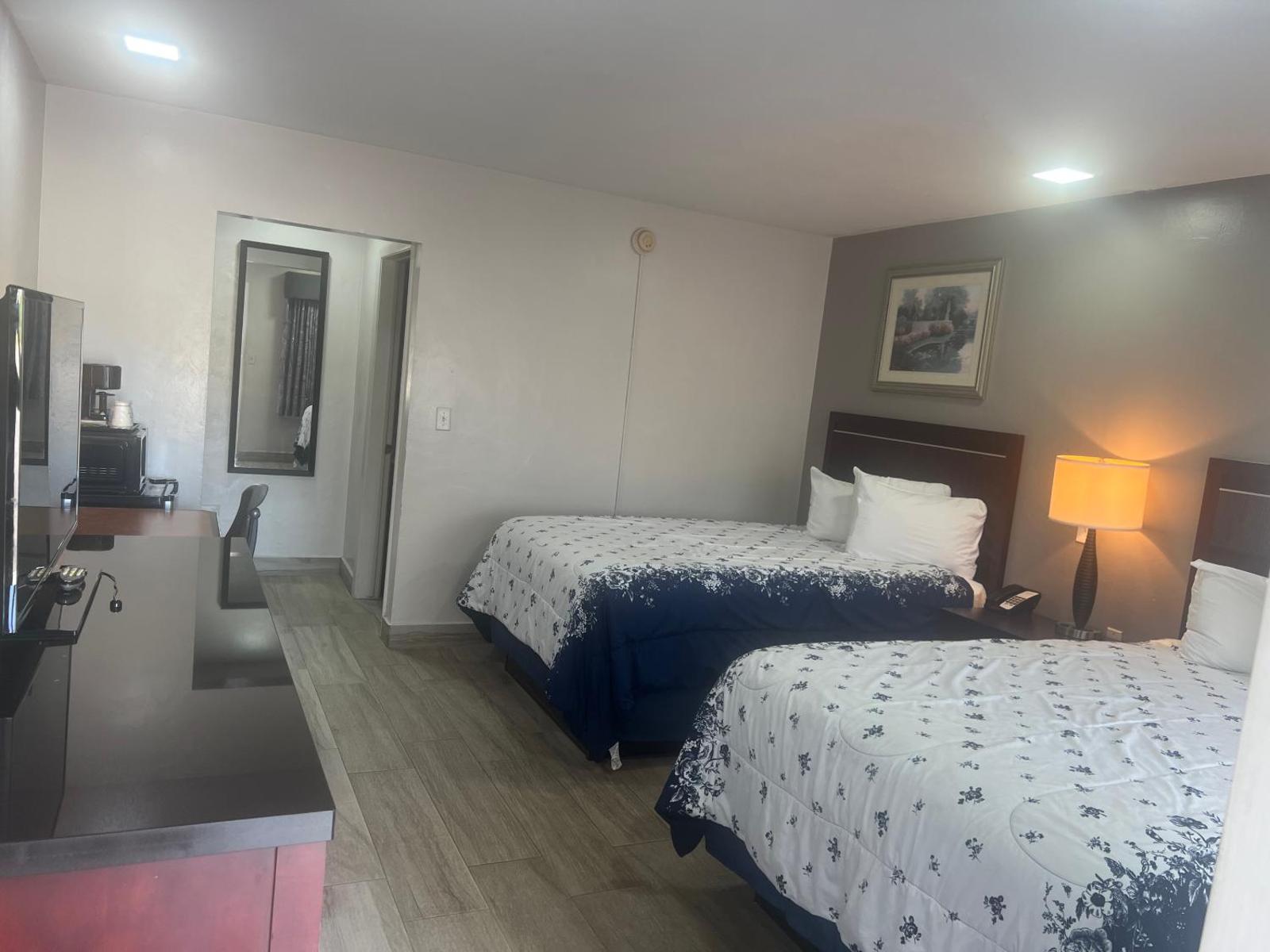 Spacious Flamingo Inn Sarasota guest room with two beds
